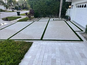 Exposed Aggregate Driveway with Grass Chases & Marble Walks